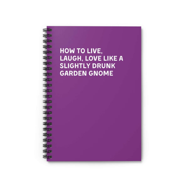 Spiral notebook with purple cover titled 'How to Live, Laugh, Love Like a Slightly Drunk Garden Gnome'.