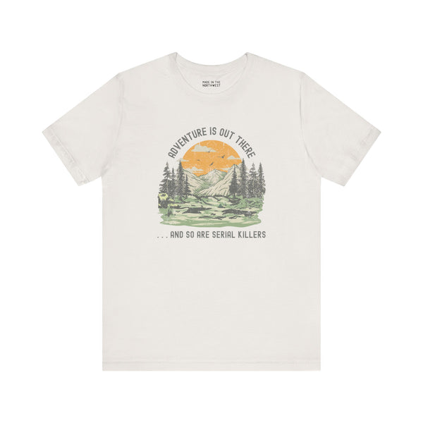 Premium soft tee featuring 'Adventure Is Out There... And So Are Serial Killers' graphic for true crime fans.