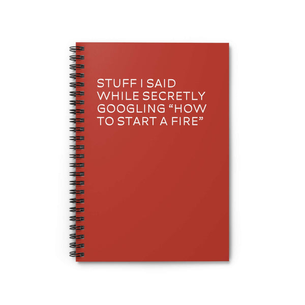 Red spiral notebook with witty text about secretly Googling how to start a fire.