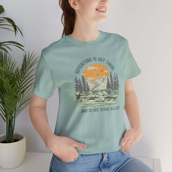 Woman wearing Adventure Is Out There And So Are Serial Killers soft tee, perfect for true crime fans and outdoor adventures.