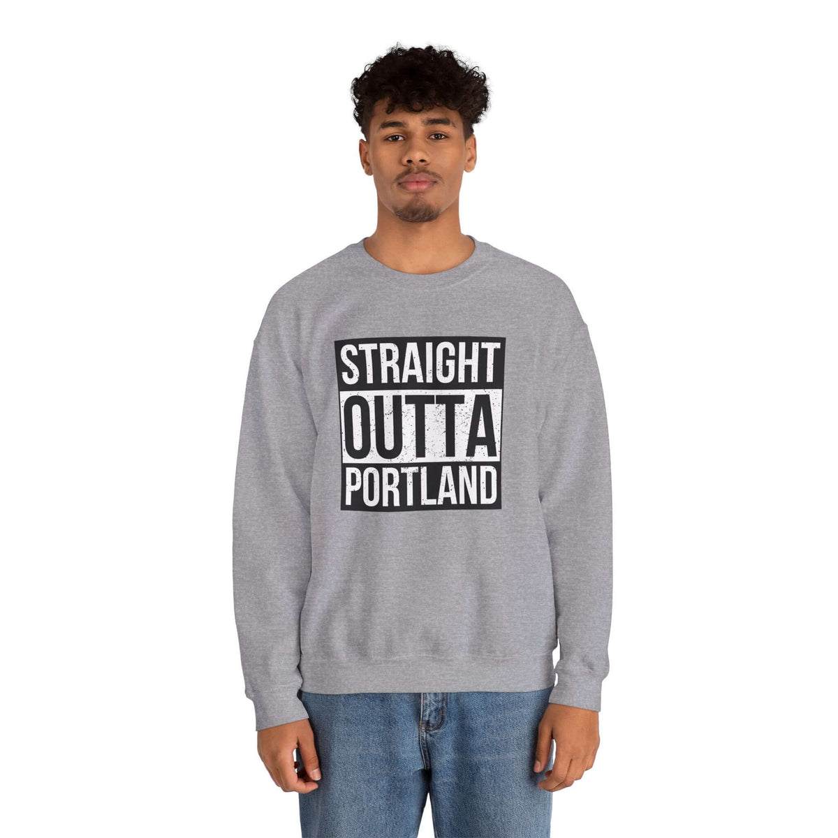 Man wearing gray "Straight Outta Portland" sweatshirt, showcasing city pride with bold streetwear style.