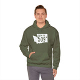 Model wearing From the 509 Spokane hoodie in olive green, showcasing Washington state silhouette and local pride.