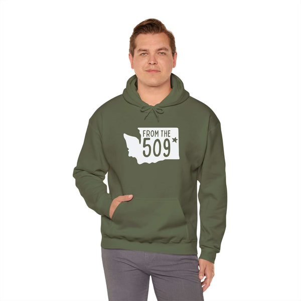 Model wearing From the 509 Spokane hoodie in olive green, showcasing Washington state silhouette and local pride.