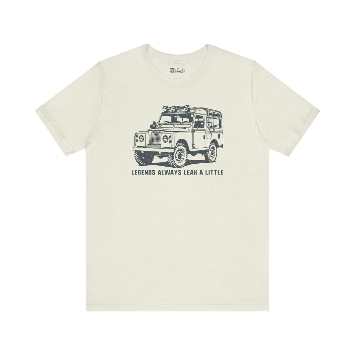 Legends Always Leak a Little tee featuring Land Rover Series II graphic on a soft cream shirt.