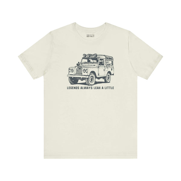 Legends Always Leak a Little tee featuring Land Rover Series II graphic on a soft cream shirt.
