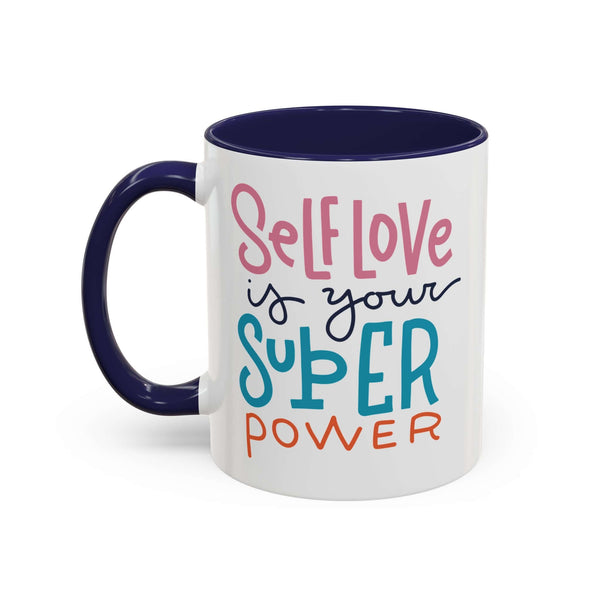 Self Love Is Your Super Power Mug featuring colorful text on a ceramic design with navy interior.