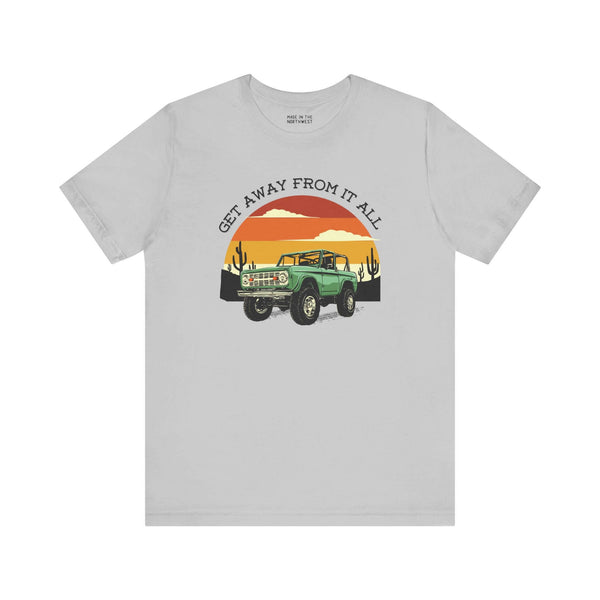 Vintage Bronco graphic tee with sunset design ideal for adventure lovers and those seeking freedom from daily life.
