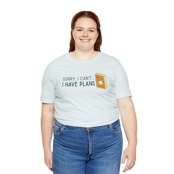 Woman wearing "Sorry I Can't - I Have Camping Plans" premium soft tee, perfect for book lovers and outdoor enthusiasts.