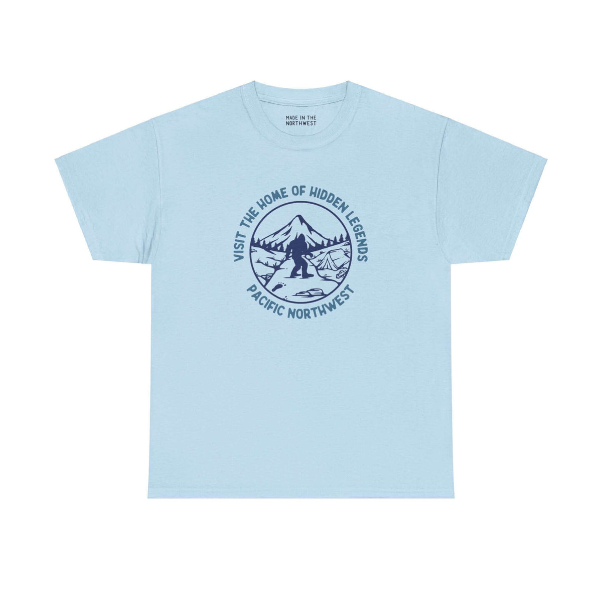 Blue t-shirt featuring a Bigfoot design with "Visit the Home of Hidden Legends" text, perfect for fans of Northwest folklore.