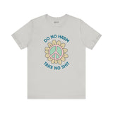 Graphic tee featuring 'Do No Harm, Take No Sh!t' with a peace flower design. Soft and stylish for good vibes.