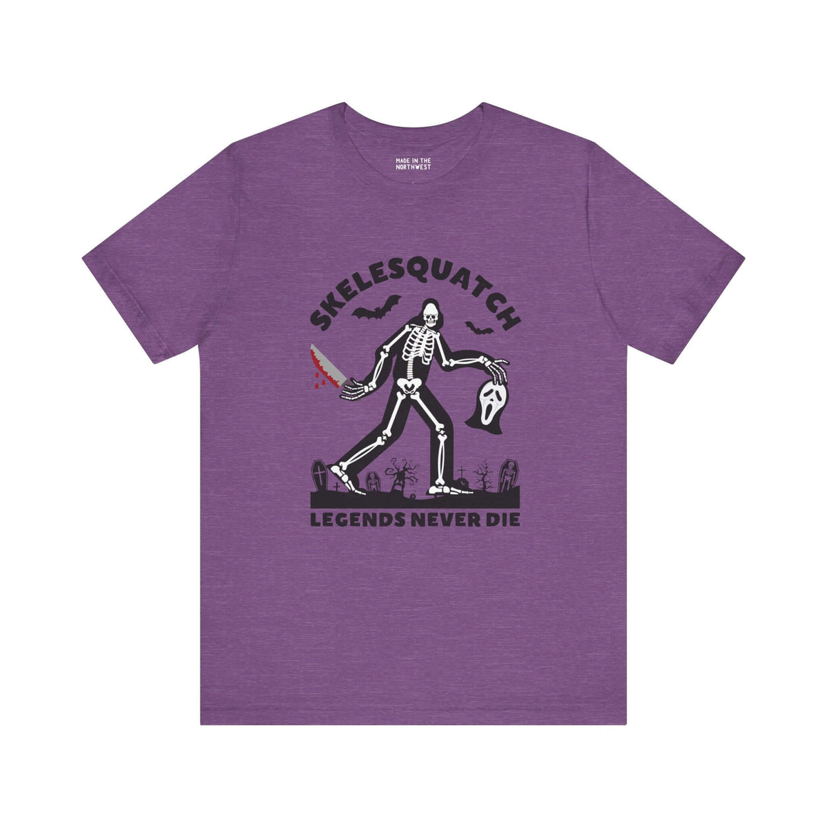 Skelesquatch Legends Never Die Halloween Soft Tee with skeleton sasquatch, bloody knife, Scream mask, purple background.