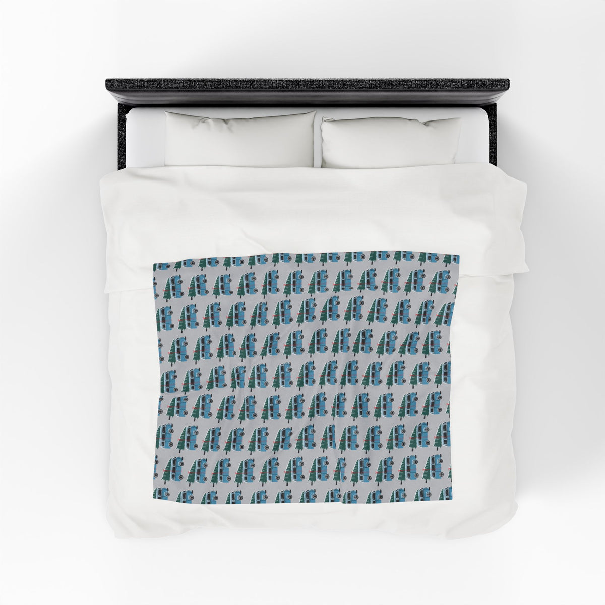 Camper van blanket featuring vintage Volkswagen buses in a repeated pattern for cozy holiday adventures.