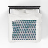 Camper van blanket featuring vintage Volkswagen buses in a repeated pattern for cozy holiday adventures.