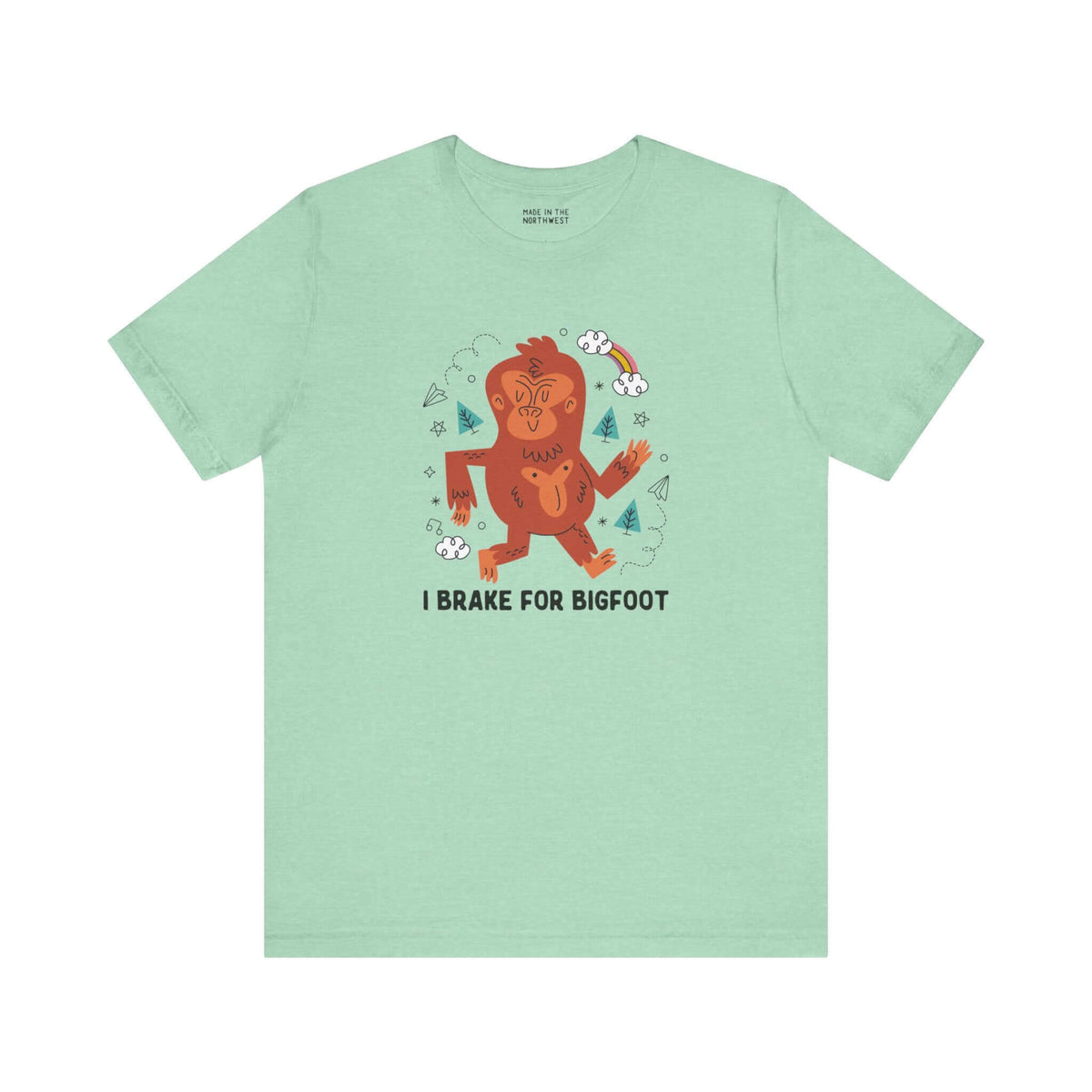 I Brake for Bigfoot Soft Tee Show your playful side and love for local folklore with our "I Brake for Bigfoot" Sasquatch Tee. This fun design features the phrase "I Brake for Bigfoot" alongside a whimsical graphic of a Sasquatch, perfect for those who enj