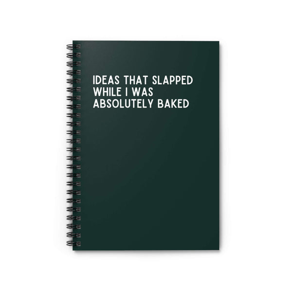 Spiral notebook titled 'Ideas That Slapped While I Was Absolutely Baked' with a dark green cover and white text.
