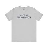 Made in Washington log font premium soft tee showcasing bold lettering on a light gray shirt.