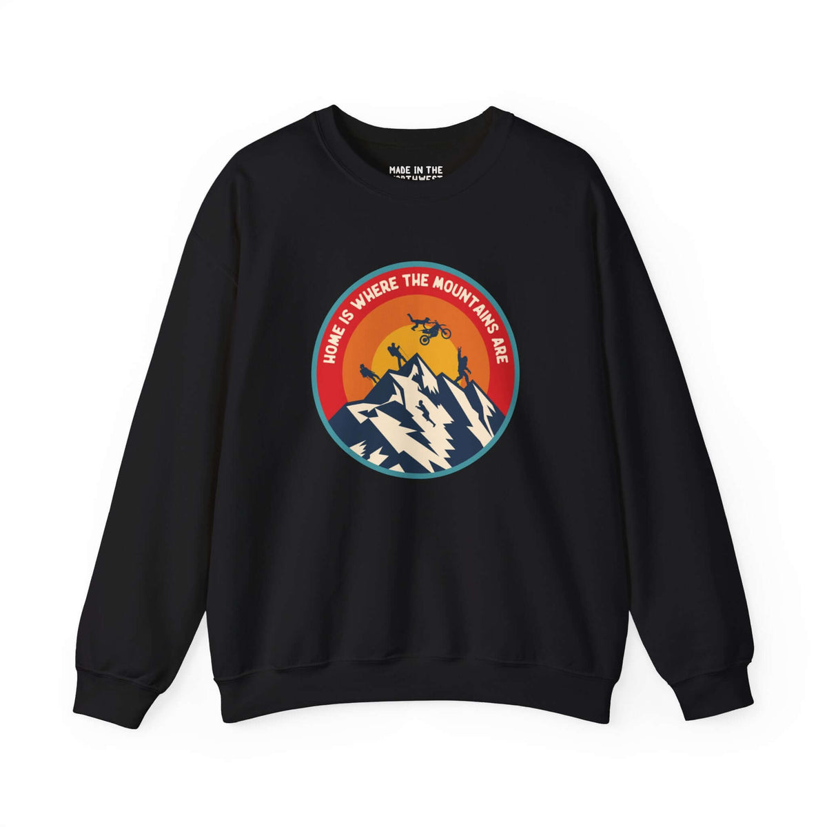 Home is Where the Mountains Are sweatshirt with PNW design featuring mountains, motocross, hiking, and Bigfoot in colorful circle.