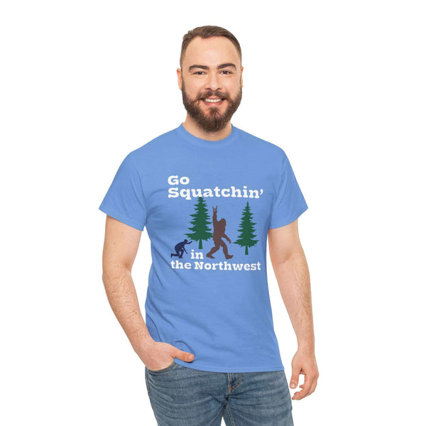 Man wearing blue "Go Squatchin' in the Northwest" athletic tee featuring Sasquatch and trees design, perfect for Bigfoot enthusiasts.