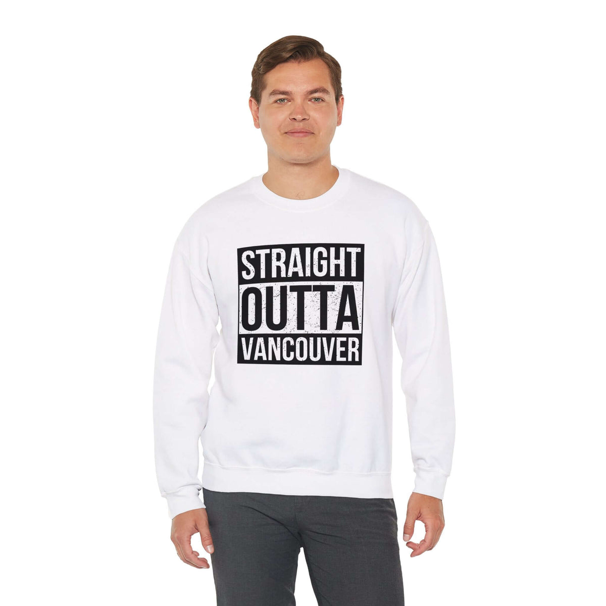 Person wearing Straight Outta Vancouver sweatshirt with bold black lettering, showcasing city pride and streetwear style.