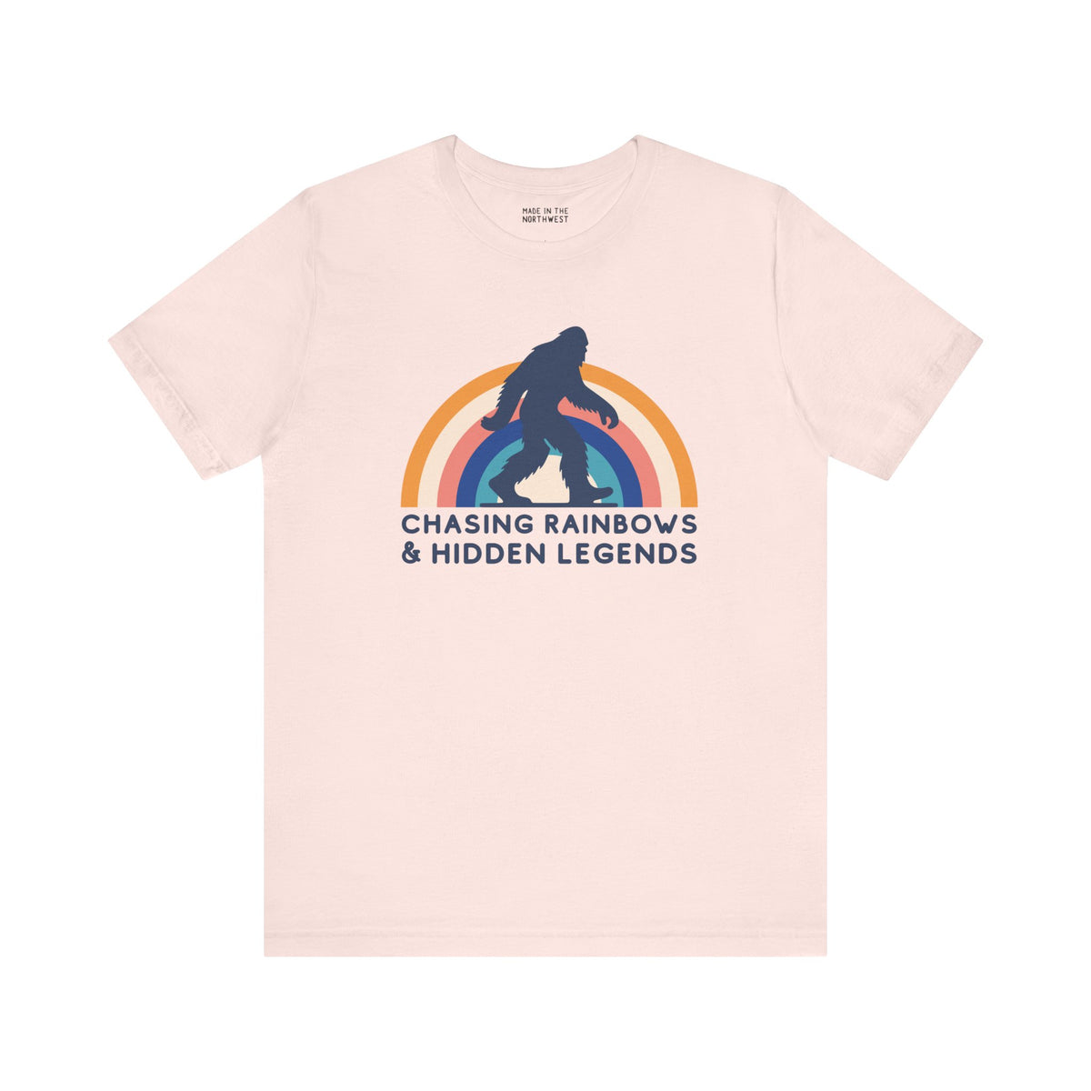 Chasing Rainbows and Hidden Legends premium soft tee with Sasquatch and vibrant rainbow graphic.