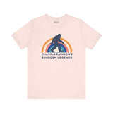 Chasing Rainbows and Hidden Legends premium soft tee with Sasquatch and vibrant rainbow graphic.
