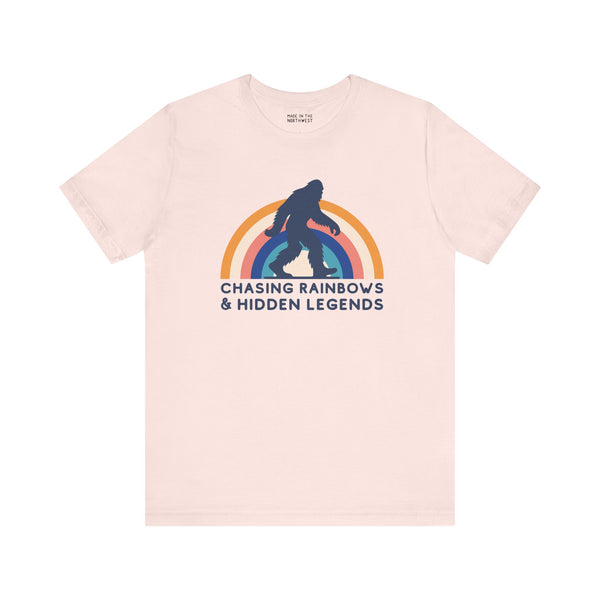 Chasing Rainbows and Hidden Legends premium soft tee with Sasquatch and vibrant rainbow graphic.