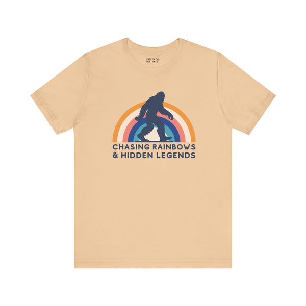 Chasing Rainbows and Hidden Legends soft tee featuring Sasquatch graphic and vibrant rainbow design.