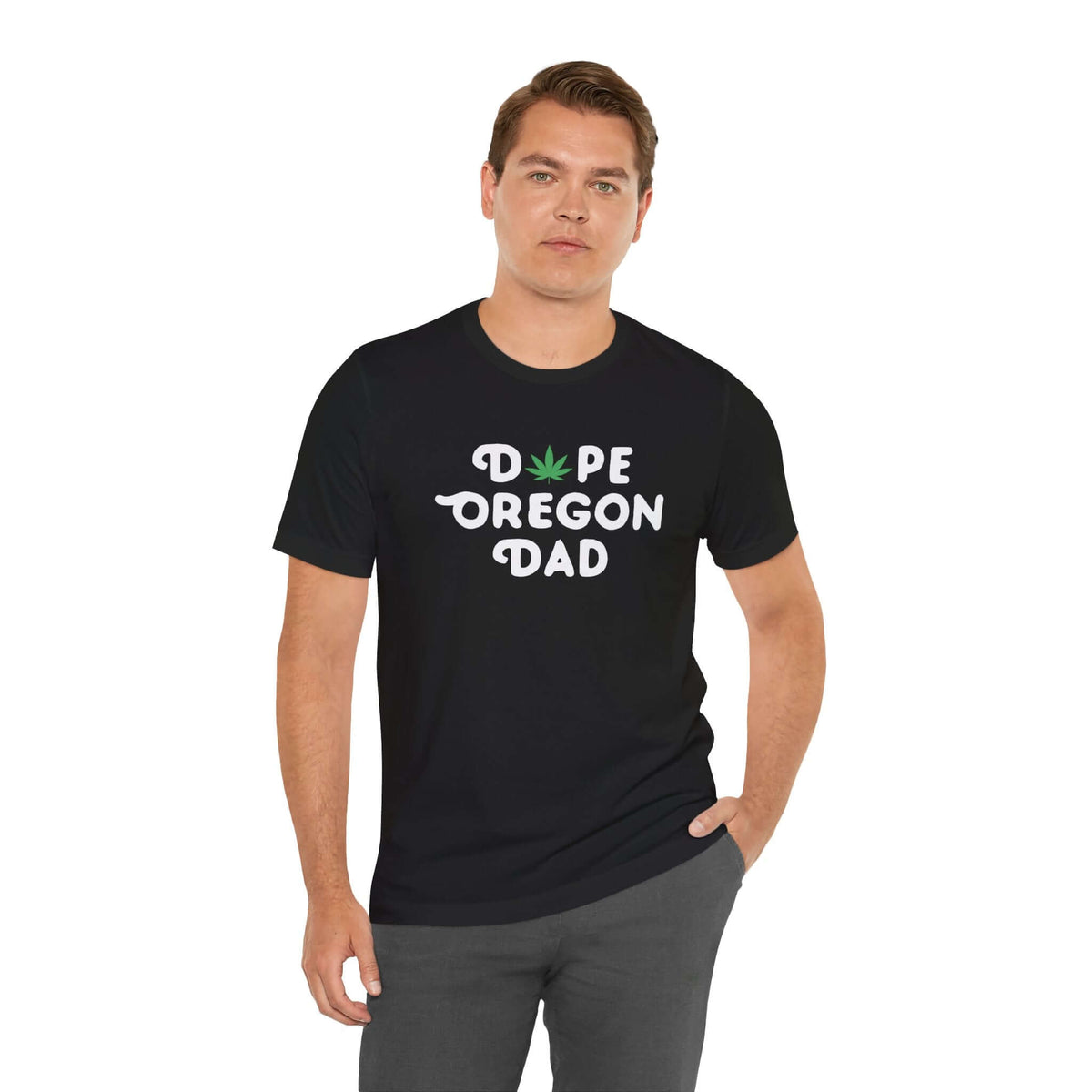 "Man wearing Dope Oregon Dad tee with marijuana leaf design, proudly representing Oregon's chill dad vibe in black shirt."