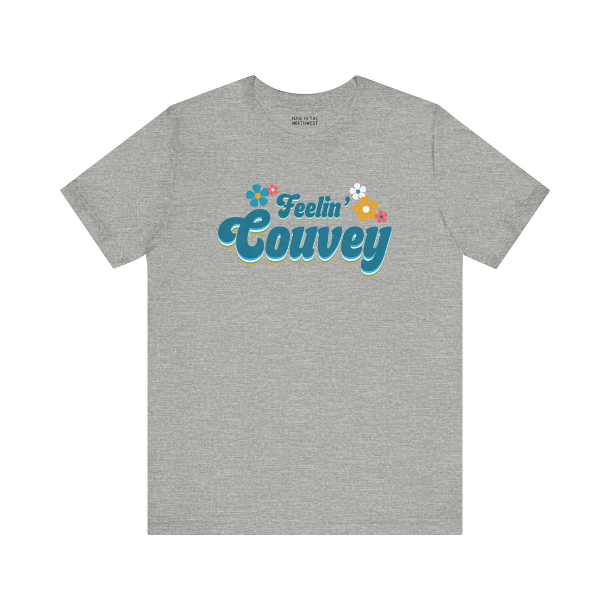 Feelin' Couvey Retro Soft Tee Embrace the vibrant spirit of Vancouver, Washington with our "Feelin' Couvey" Retro Tee! This playful design features the phrase "Feelin' Couvey" in a nostalgic 70s font, complete with colorful aqua and pink flowers. A fun tw