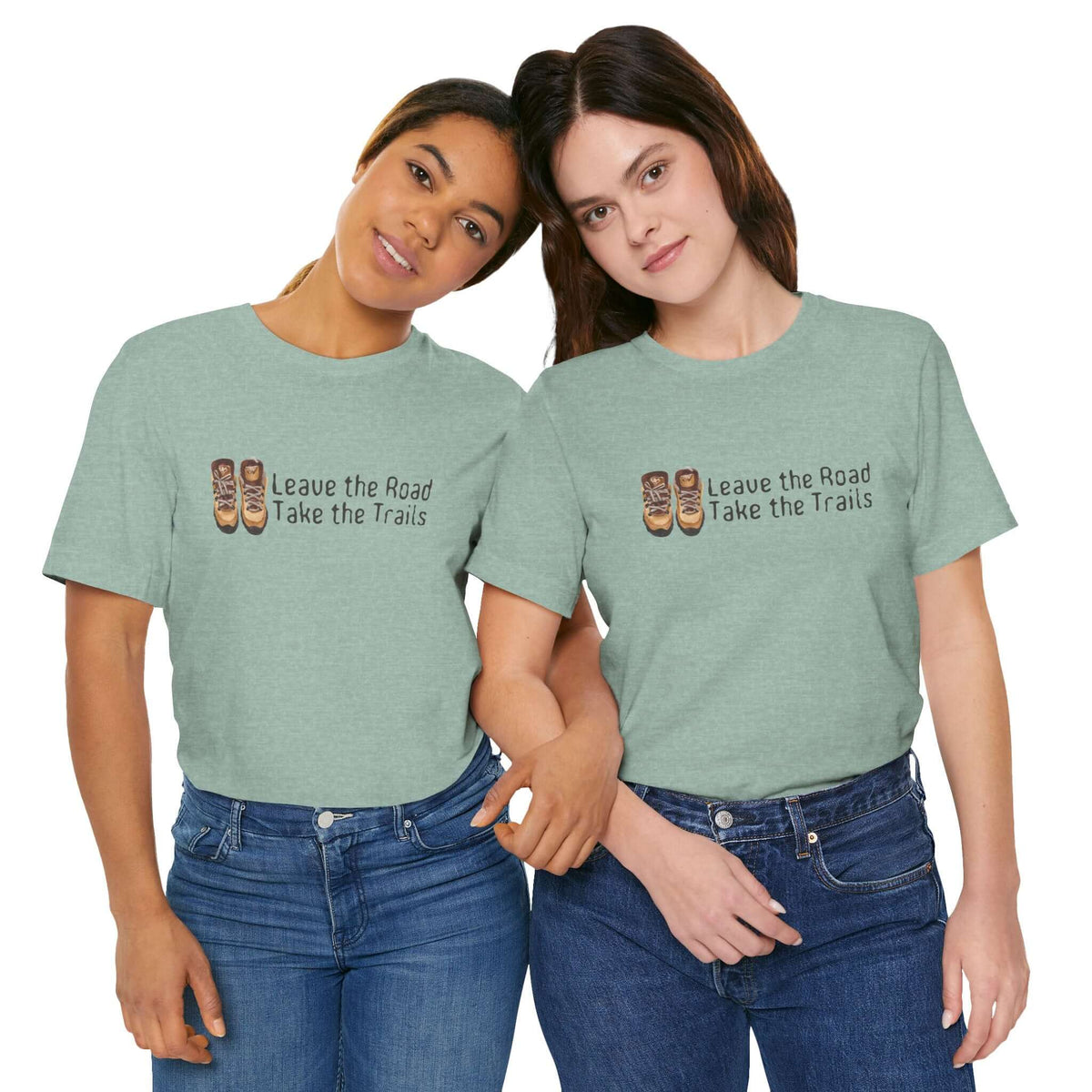 Two women wearing Leave the Road, Take the Trails premium soft tee in green, perfect for outdoor adventure lovers.