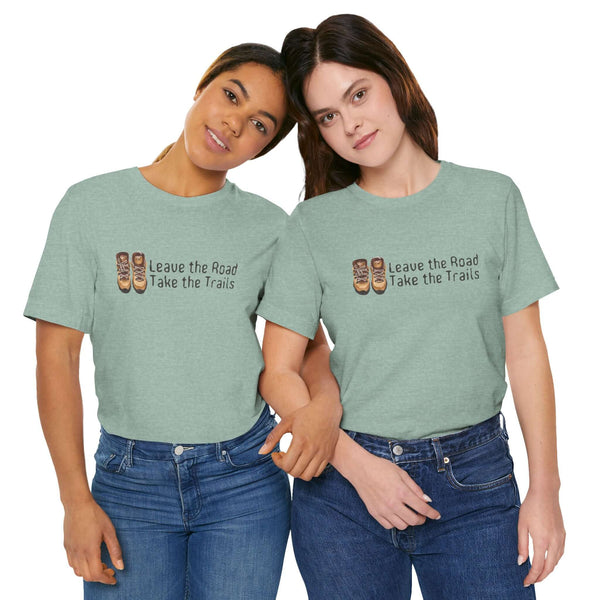 Two women wearing Leave the Road, Take the Trails premium soft tee in green, perfect for outdoor adventure lovers.