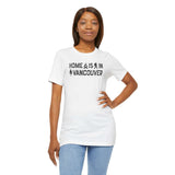 Home Is in Vancouver Tee displayed by model, showcasing PNW pride with campfire and Bigfoot design.