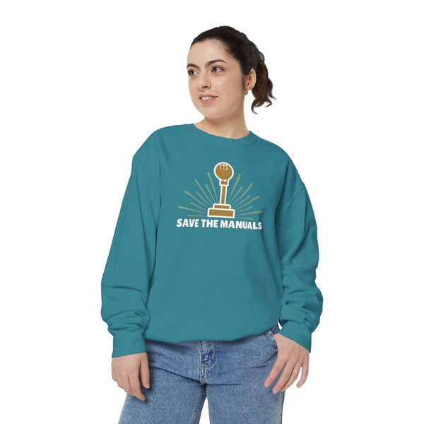 Save the Manuals Sweatshirt featuring embroidered stick-shift graphic on a woman wearing teal sweatshirt.
