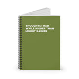 Green spiral notebook with the title 'Thoughts I Had While Higher Than Mount Rainier' on the cover.
