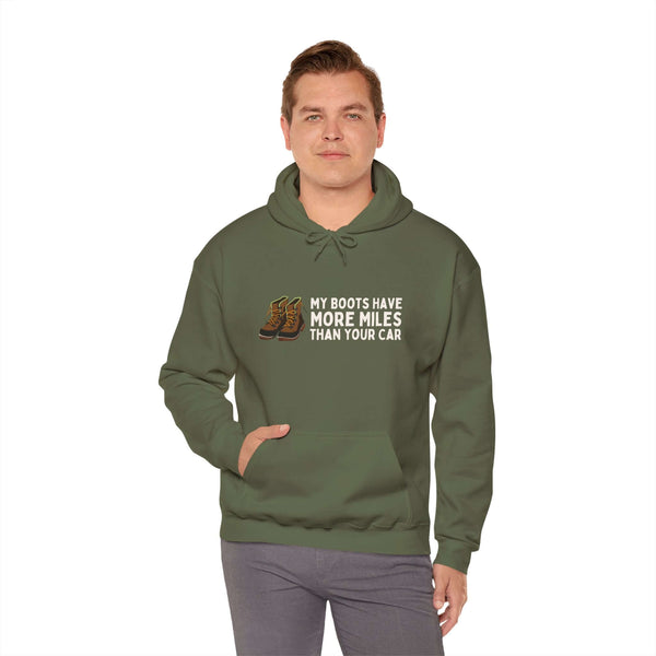 Unisex hoodie in olive green with the text 'My Boots Have More Miles Than Your Car' for outdoor enthusiasts.