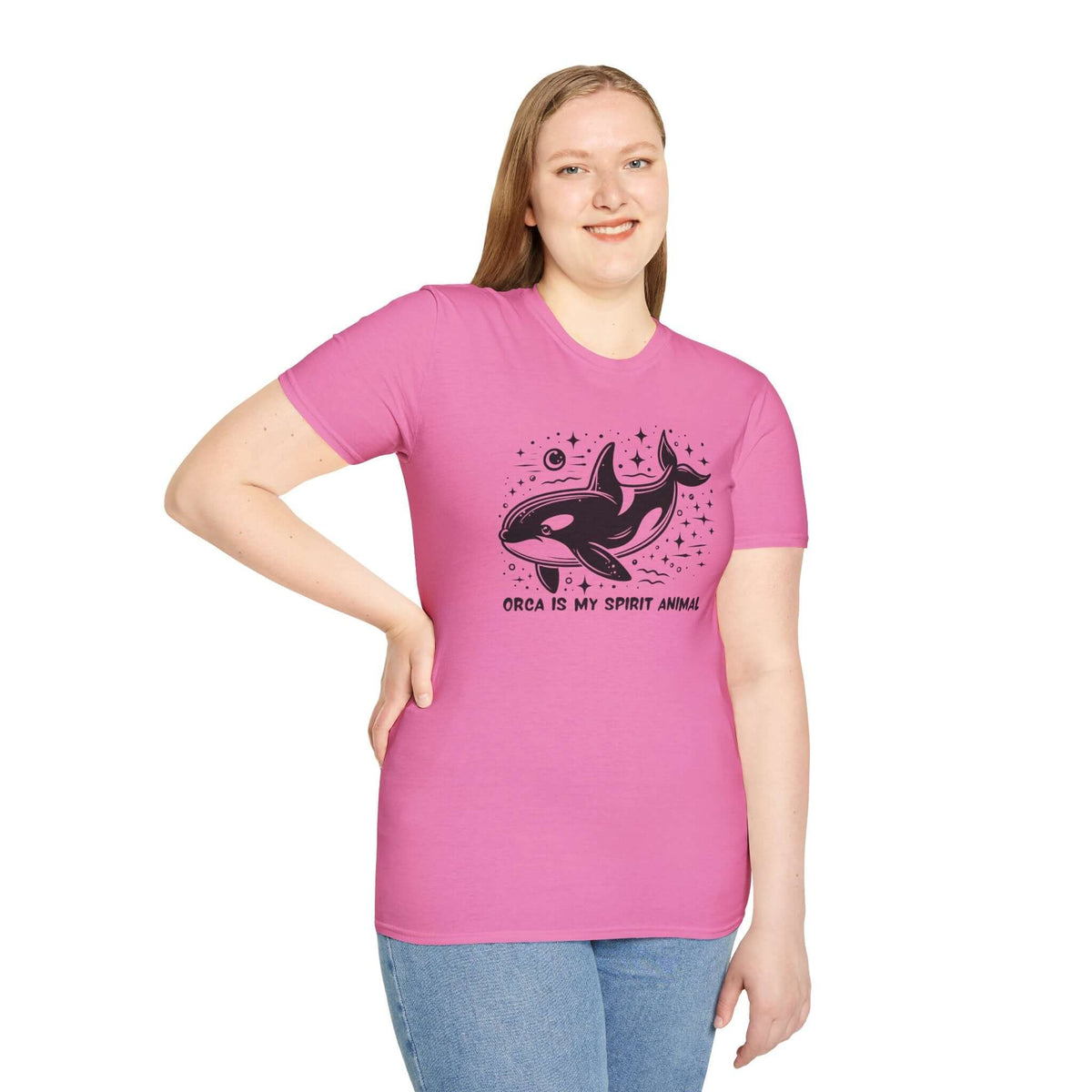Woman wearing pink Orca Is My Spirit Animal Softstyle T-Shirt featuring a stylish orca graphic design.
