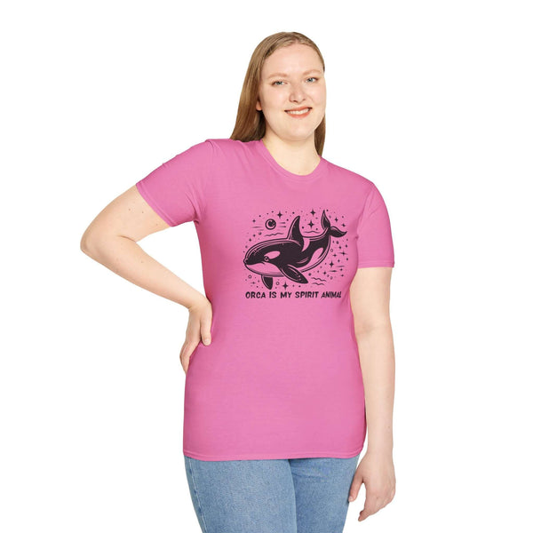 Woman wearing pink Orca Is My Spirit Animal Softstyle T-Shirt featuring a stylish orca graphic design.