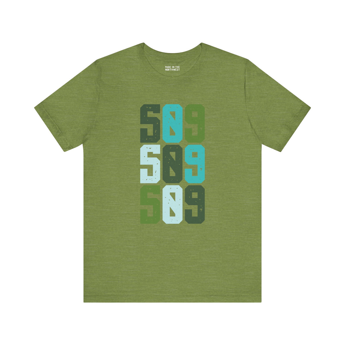 Five-Oh-Nine Pop Premium Soft Tee featuring a stacked 509 design in vibrant greens and blues on a green background.