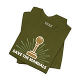 Save the Manuals T Shirt featuring a gearshift graphic on an olive green tee for car enthusiasts.