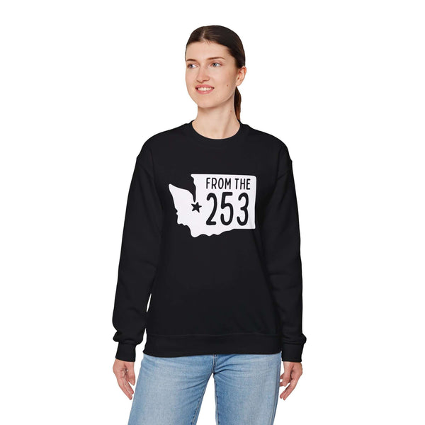 Woman wearing "From the 253" sweatshirt with Washington state silhouette and Tacoma star, showcasing local pride and style.