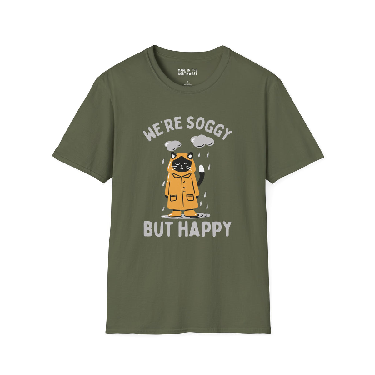 We're Soggy But Happy t-shirt featuring a drenched cat in a raincoat, perfect for Pacific Northwest lovers.