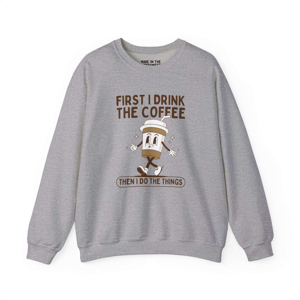 Gray sweatshirt with coffee cup graphic and text 'First I Drink the Coffee Then I Do the Things'