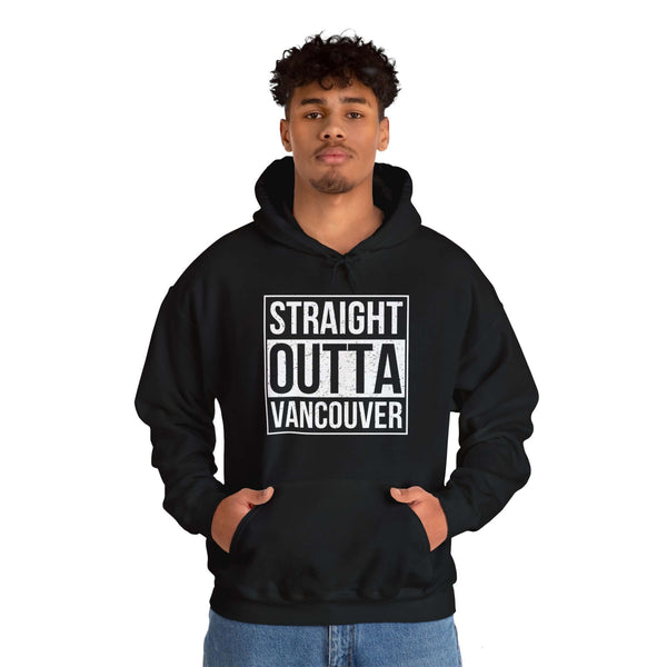 Man wearing Straight Outta Vancouver hoodie, black with bold lettering, showing city pride in stylish streetwear.