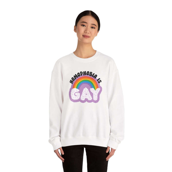 Model wearing Homophobia Is Gay sweatshirt with rainbow and cloud design for pride and style.