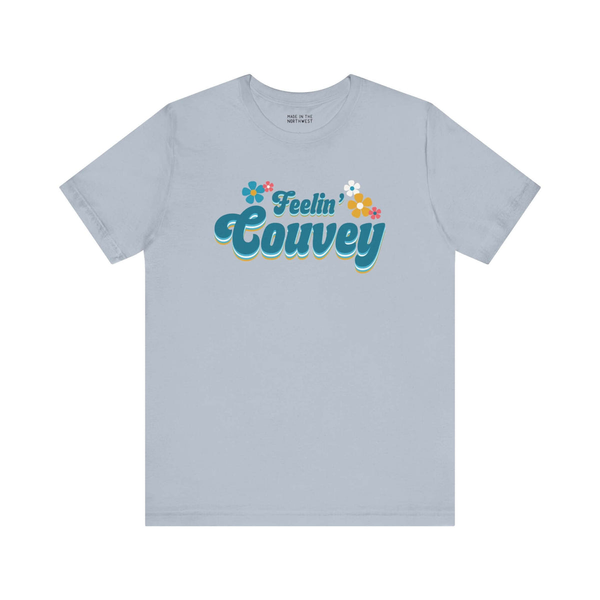 Feelin' Couvey Retro Soft Tee Embrace the vibrant spirit of Vancouver, Washington with our "Feelin' Couvey" Retro Tee! This playful design features the phrase "Feelin' Couvey" in a nostalgic 70s font, complete with colorful aqua and pink flowers. A fun tw