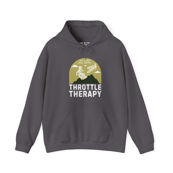 "Throttle Therapy hoodie featuring dirt bikers and mountain backdrop, perfect for motocross enthusiasts seeking adventure and thrills."