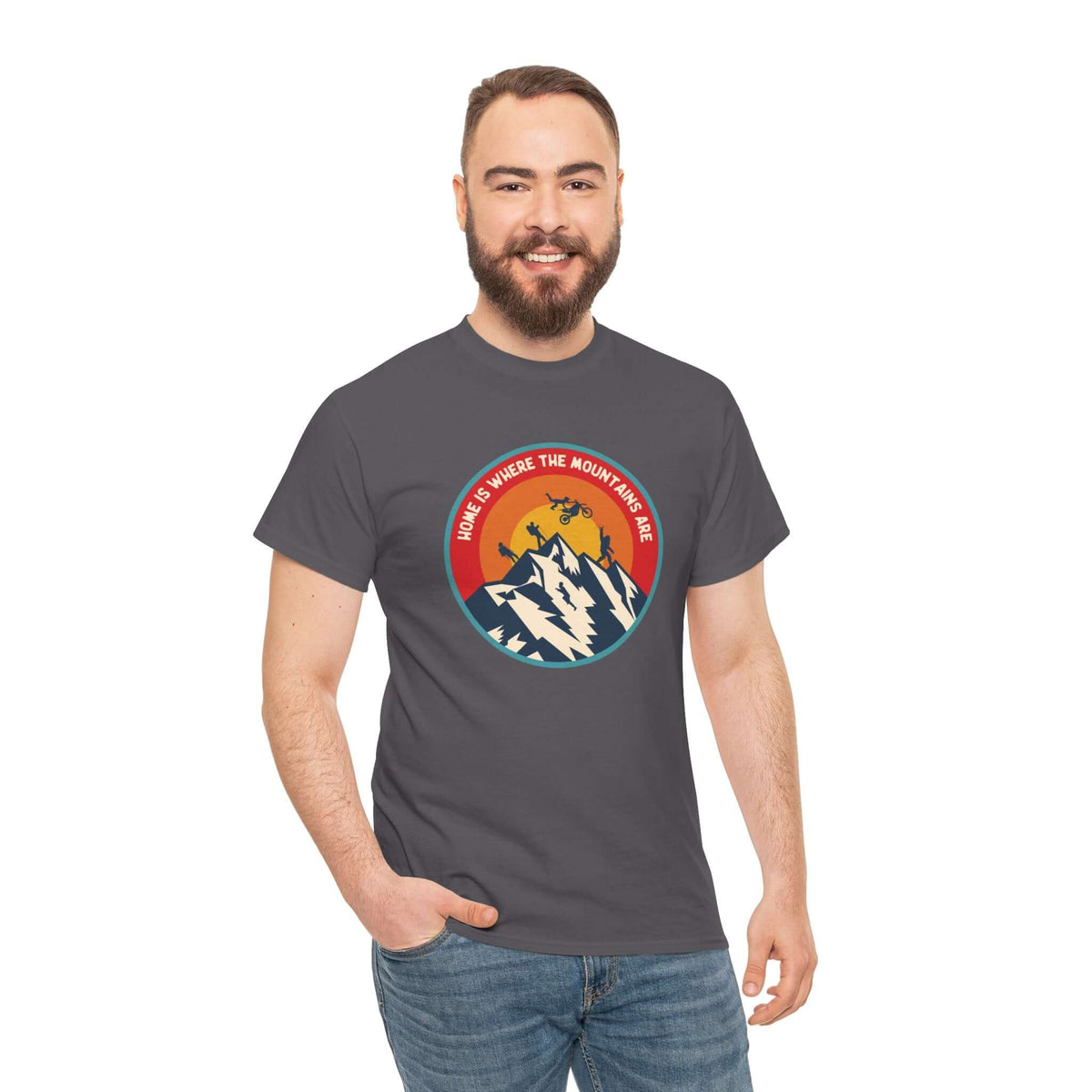 Man wearing "Home is Where the Mountains Are" athletic tee featuring PNW activities and Bigfoot, perfect for outdoor enthusiasts.