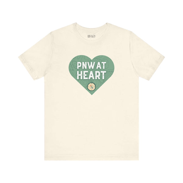 "PNW at Heart Compass Soft Tee with heart and compass design showcasing Pacific Northwest pride."