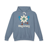 Stay Groovy hoodie featuring a retro daisy character and playful peace signs on a blue sweatshirt.