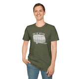 Man wearing Out of Office Camper Softstyle T-Shirt, featuring a retro travel trailer design, ideal for adventure lovers.